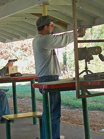 Photograph of Tony shooting a Kimber .45 ACP that his Dad gave him.